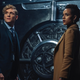 Matthias Schweighöfer and Nathalie Emmanuel stand in front of a giant safe in Army of Thieves.